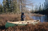 Pinip, an Innu hunter, with his canoe. Photograph: Bryan & Cherry Alexander Photography