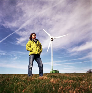 Dale Vince stands in front of the wind turbine at Lynch Knoll