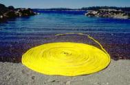 Time and Tides - floating yellow rope coil with incoming tide, Alaska, by Gloria Lamson Photograph C