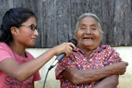 A young girl interviewing her grandmother about community conservation efforts in the Chinantla region, Oaxaca, Mexico. Photograph: Nick Lunch