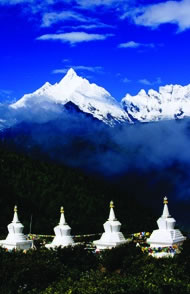 Buddhist stupas in front of Meili Xueshan mountain range including Mt Miacimu (6054m) from Naka Zhashi. Photograph: Richard I'Anson/Lonely Planet Images