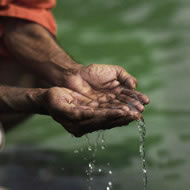 Still image from the upcoming feature documentary Holiwater showing the hands of a Deb Das Baul offering gratitude to the Ganga river in Rishikesh, India. Photograph: Andrei Jewell/Holiwater