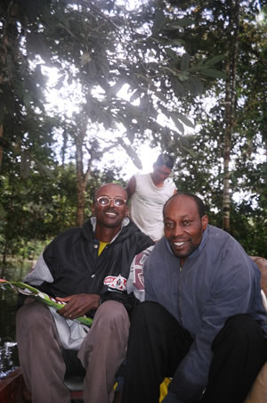 Ng'ang'a Thiong'o from Kenya and Mellese Damtie from Ethiopia on a boat on the River Amazon in Colombia in 2006, Photography The Gaia Foundation