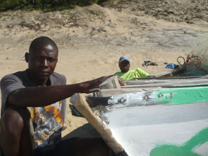 Adolfo and Arturo, local fishermen sorting their nets and carrying out minor boat repairs. Photograph by Thembi Mutch